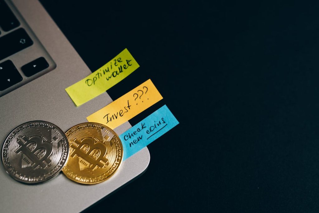 close-up-shot-of-gold-and-silver-coins-8358129 Capture the essence of cryptocurrency investments with Bitcoin coins and sticky note reminders.